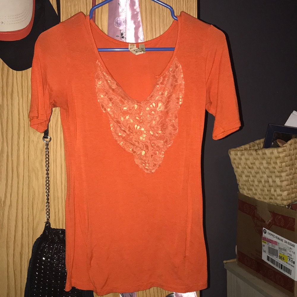 Orange buckle top